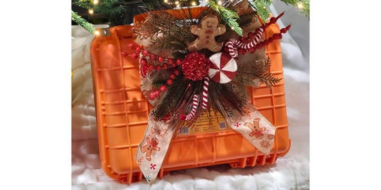 Bright orange hard-shell floating case carries marine safety items for boaters